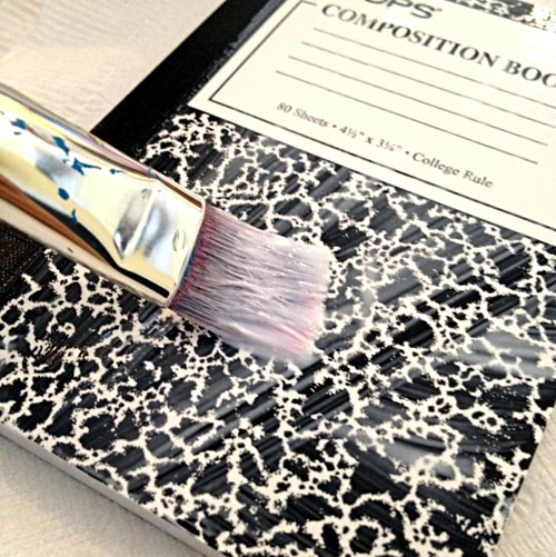 Add Mod Podge to mini book cover Add Mod Podge to mini book cover