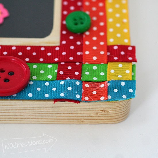 Weave the ribbon corners, adhere in place and add buttons