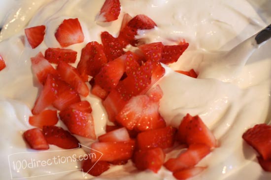 Mix together yogurt, strawberries and COOL WHIP