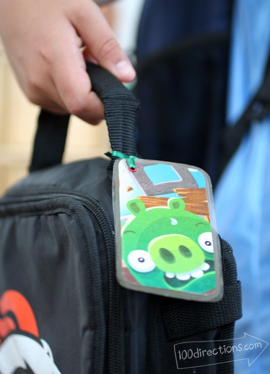 Attach another Angry Bird character ID tag to a lunch box