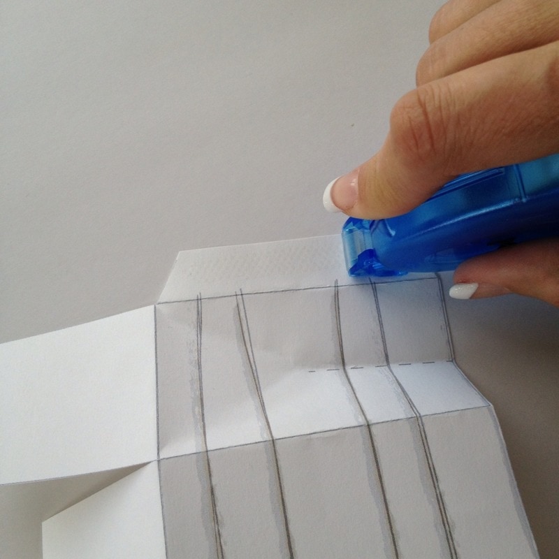Use Xyron tape runner to adhere side flap