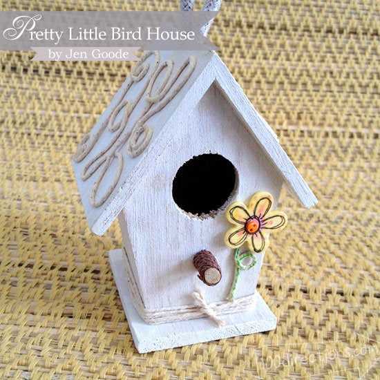 Decorated birdhouse with buttons by Jen Goode