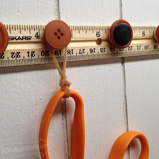 Use ribbons or rubber bands or string to hang items from button hooks