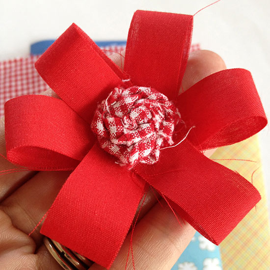 Little red fabric flower