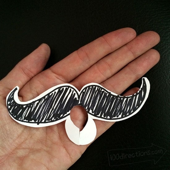 Draw a mustache cut a hole and put it on the hornq