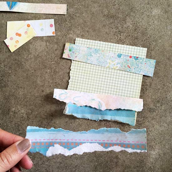 Pick the paper you'd like to use in your collage and start layering it on a base