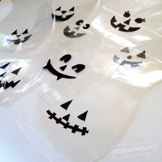 make pumpkin faces on plastic bags
