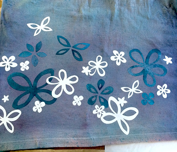 Back of dress is layers of stenciled flowers