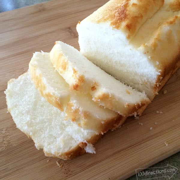 Cut angel food cake loaf into slices then cubes