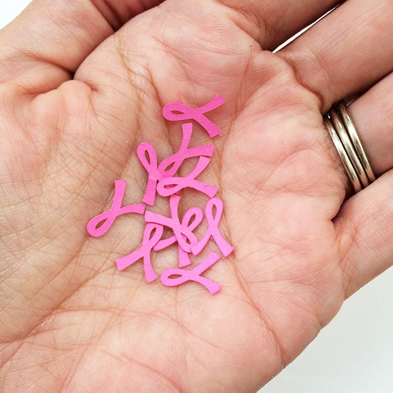 Cut tiny pink ribbons to make pink ribbon charms