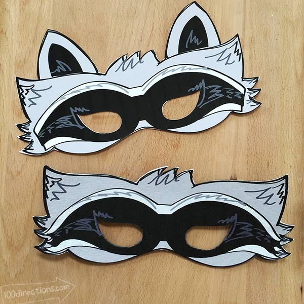 Two raccoon masks designed by Jen Goode