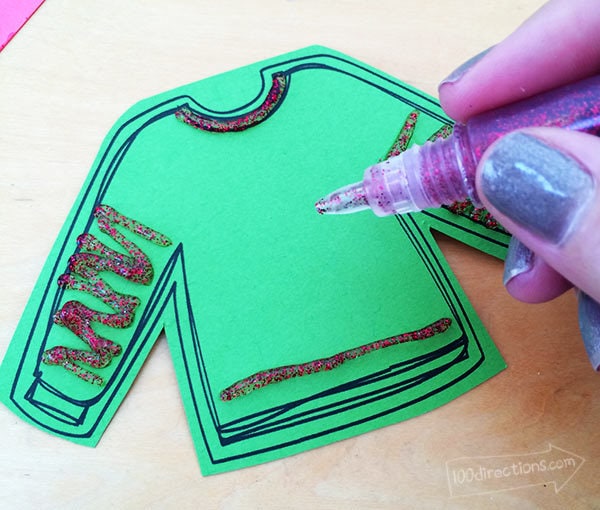 Print plain ugly sweater on colored paper and decorate