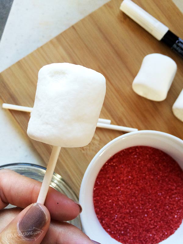 Put marshmallow on candy stick