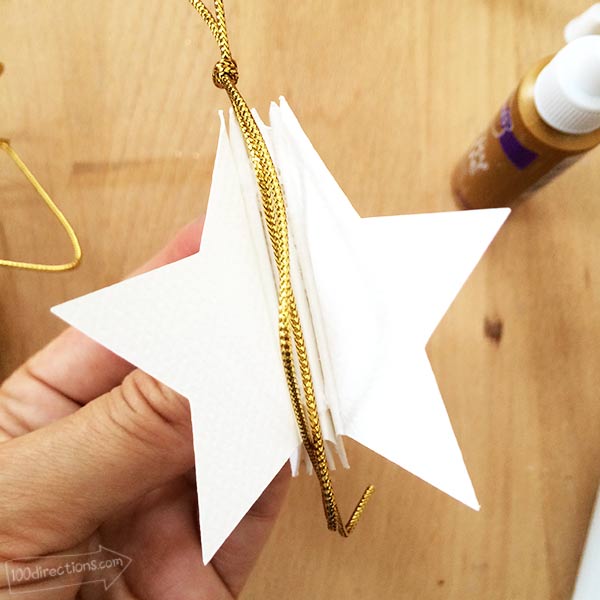 Add twine loop to center of star pieces