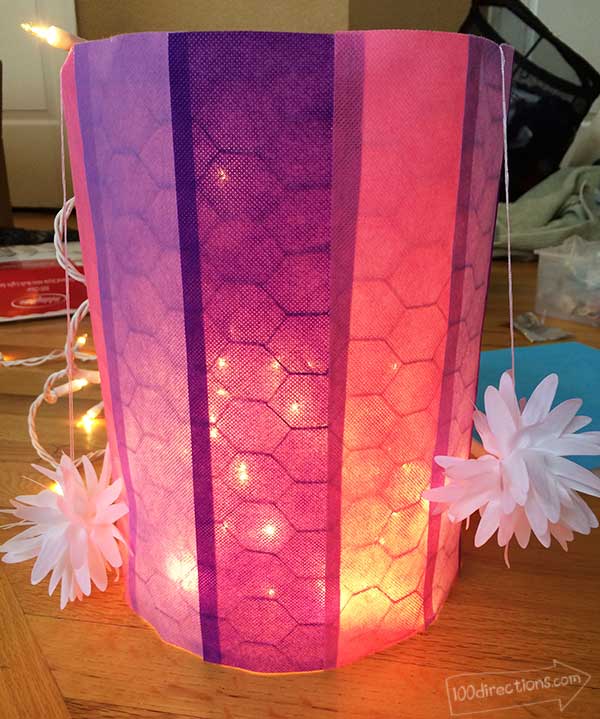 Cover with Olyfun, add lights inside and tie on flowers