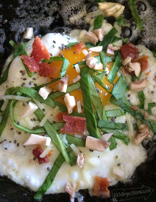 Cooking veggies with a fried egg