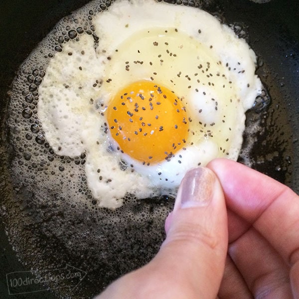 Adding chia seeds to fried eggs