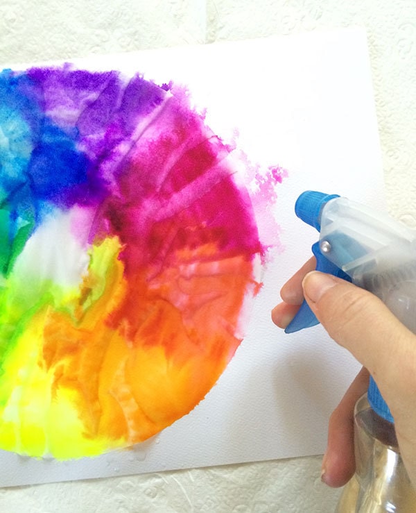 Create a watercolor look by spraying water on markers