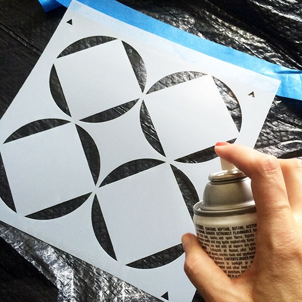 Apply spray adhesive to back of stencil