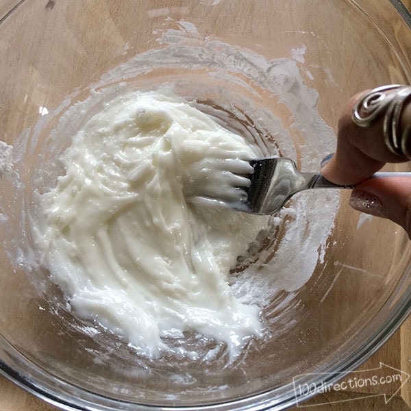 Keep stirring - add in extra milk if the icing seems too thick