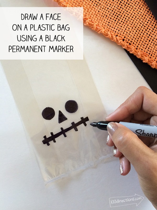 Draw a face on a plastic bag