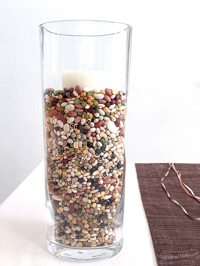 Used mixed beans to add color to a glass vase