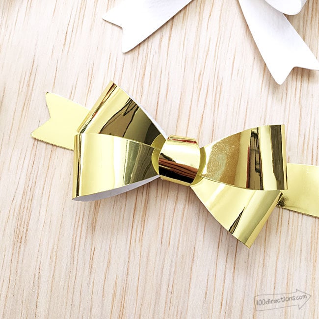 Use different papers, patterns and even glitter or foil to make your own paper bows