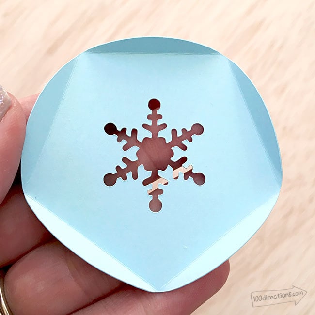 Cut 12 snowflake circles and fold along score lines