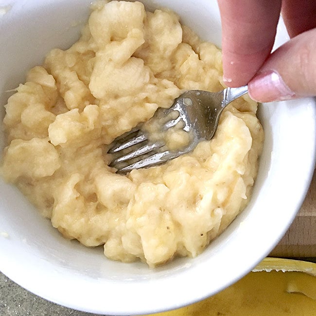 Mash bananas with a fork