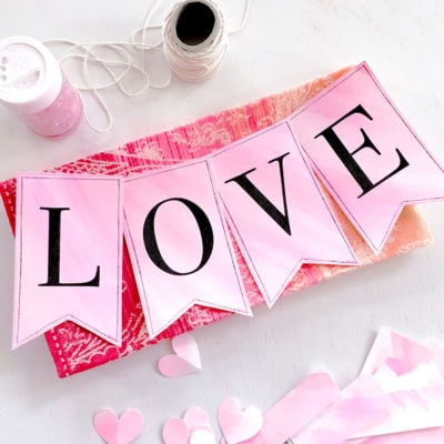 Make your own LOVE banner using paper, watercolor paints and a free printable by Jen Goode