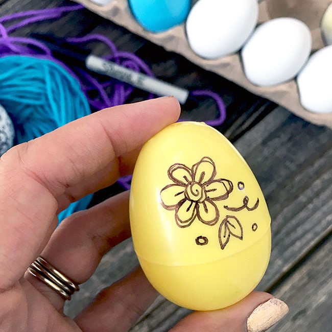Draw on plastic Easter eggs
