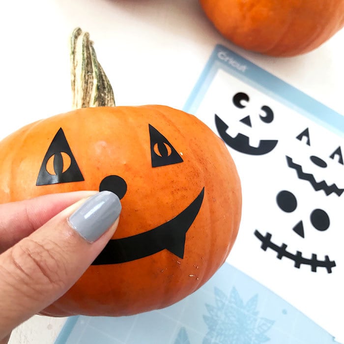 Cut pumpkin faces with your Cricut machine