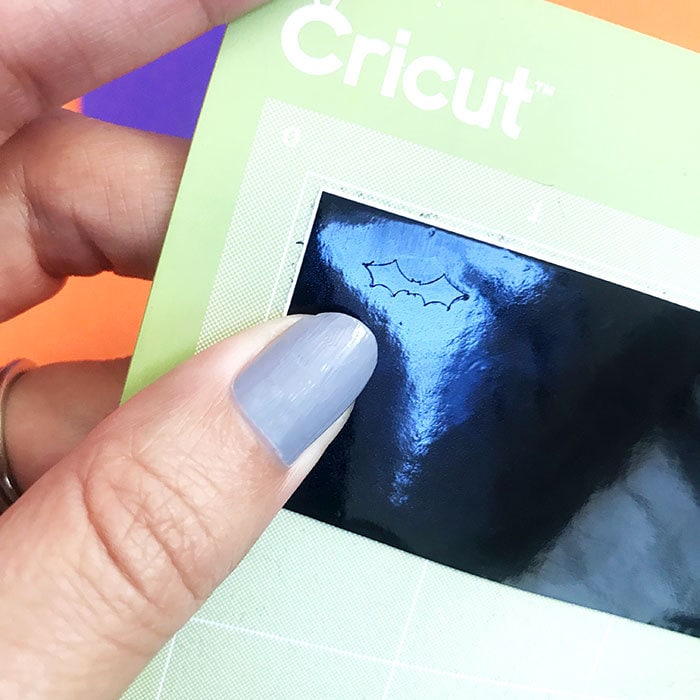 Cut a tiny bat design with your Cricut machine