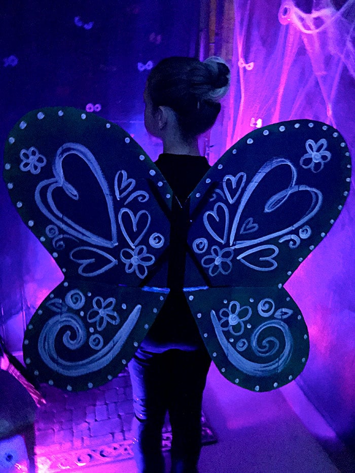 DIY Butterfly costume with art designs in blacklights