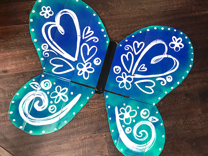 Hand-painted butterfly wing art - one side of this DIY costume. 