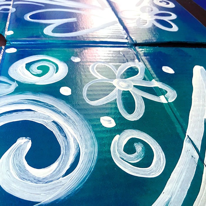 Close up of hand-painted design on Cardboard box butterfly wing costume