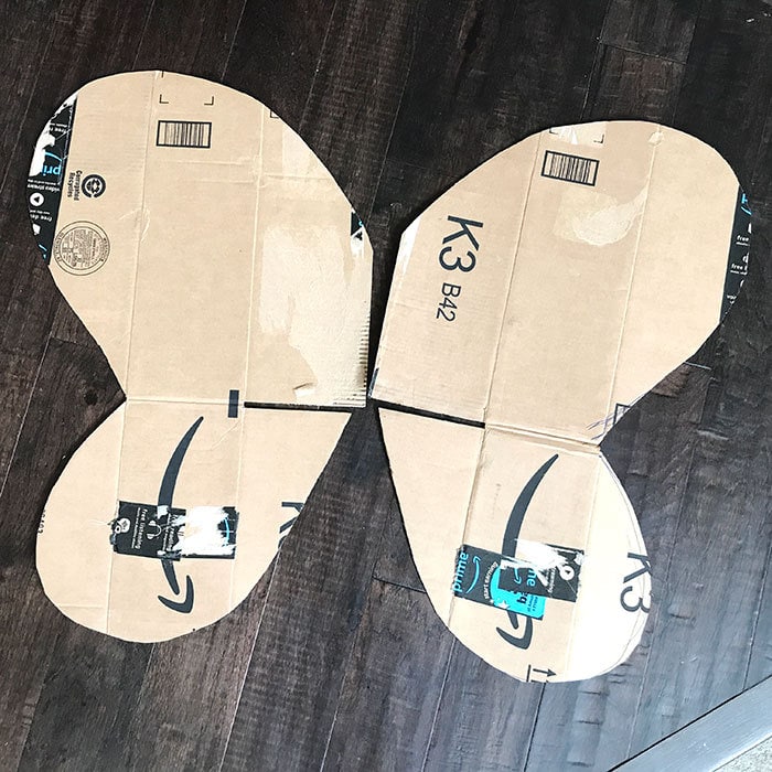 Cut butterfly wing shapes from Amazon cardboard box