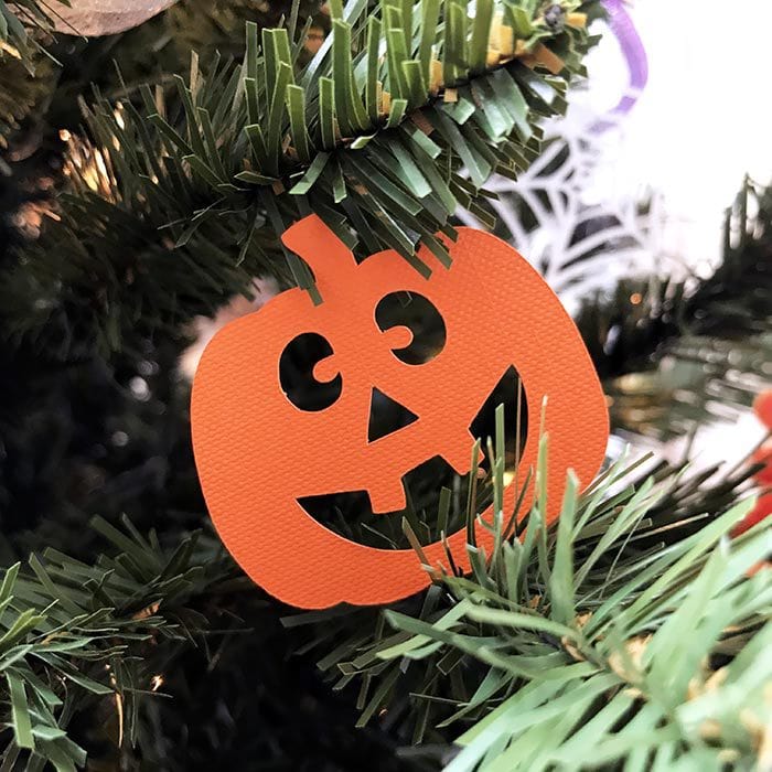 Create your own jack-o-lantern cut outs and decorate your tree