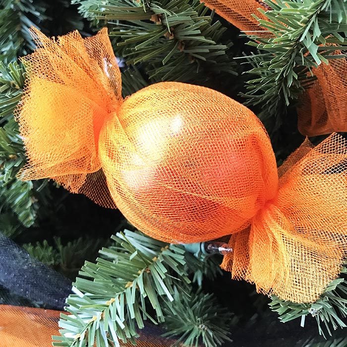 Wrap tulle around an ornament to make candy decor