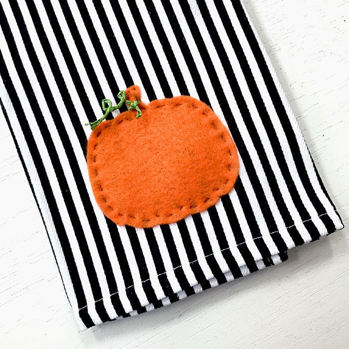 Stitch pumpkin to tea towel