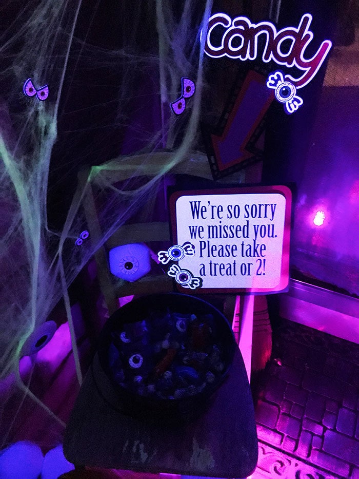 Front porch decor for Halloween at night with blacklight