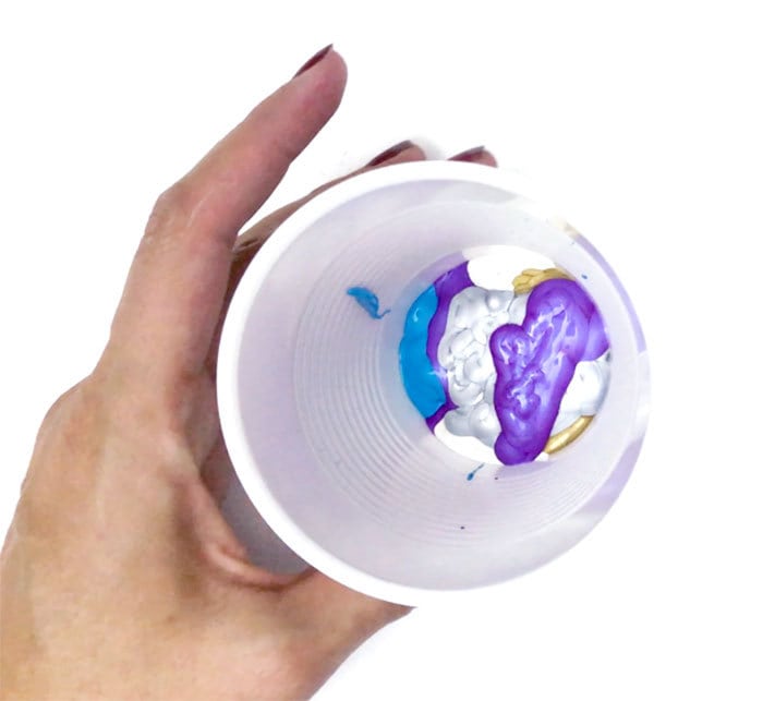 Pour layers of paint into a disposable cup