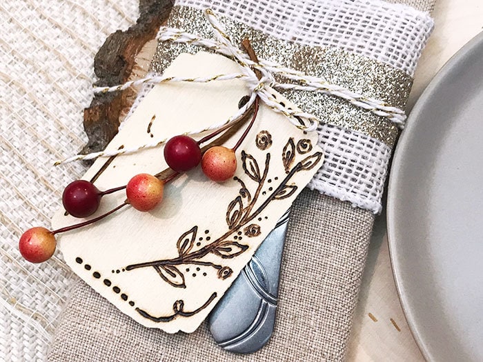 Add wood burning art tag to a napkin ring