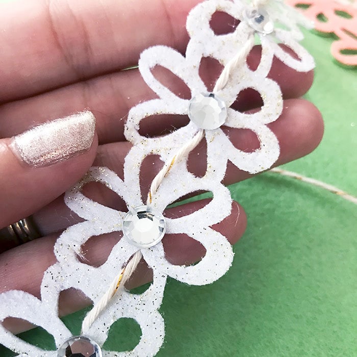 Add twine to flower cut felt to make a bracelet