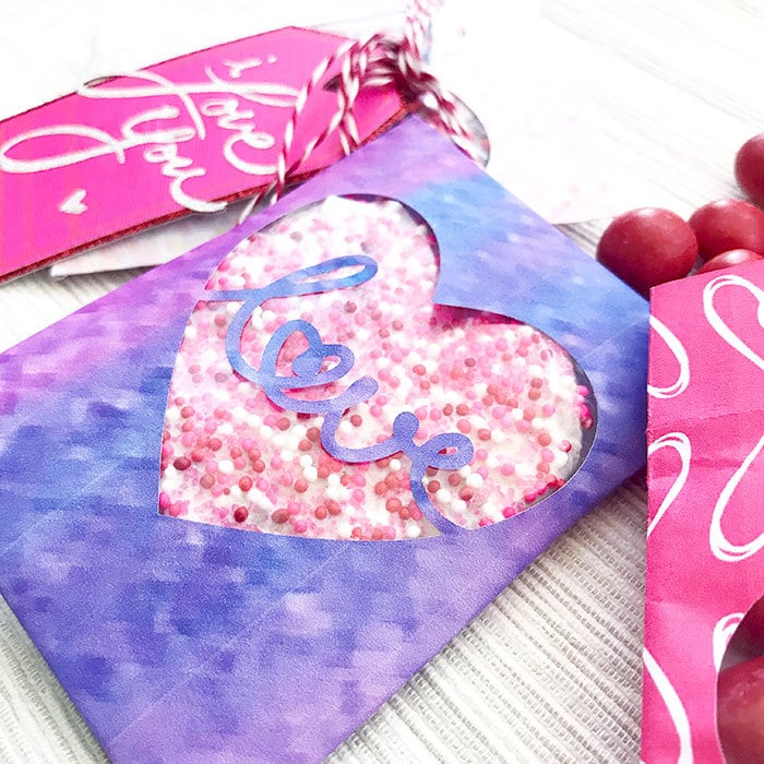 Pretty paper cut treat bags you can make with your Cricut for Valentine's Day - Designed by Jen Goode