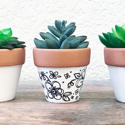 Make your own pretty little hand-draw clay pot planters