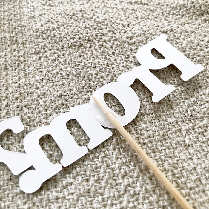 Attach a toothpick to word art for more decor use