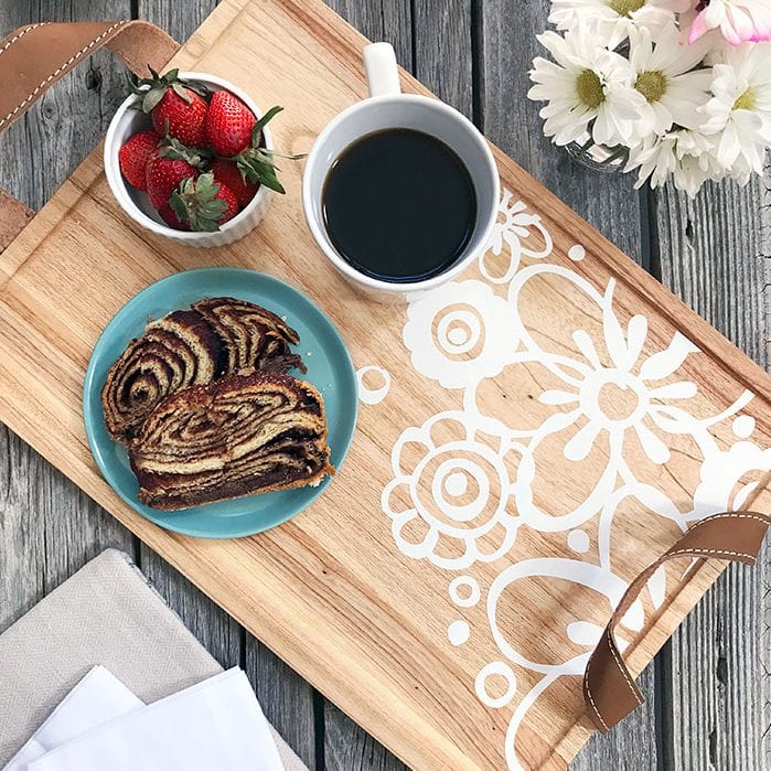 Decorate a wood serving tray with your Cricut using vinyl and a pretty floral design.