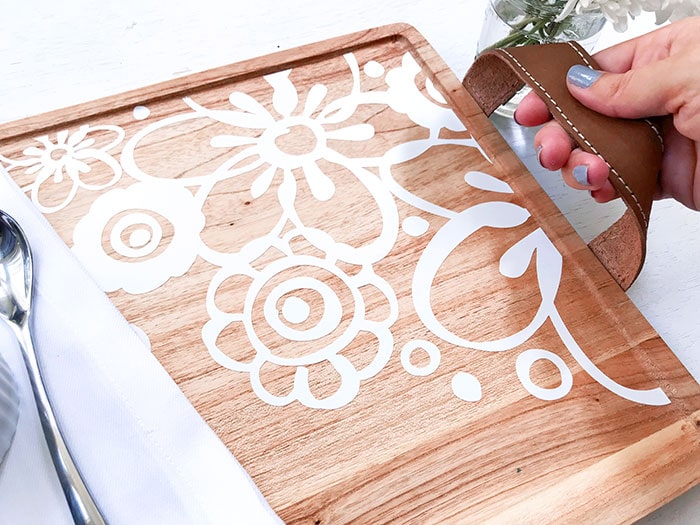 Close up of cut vinyl decorating a wood tray - fun DIY Project you can make with your Cricut