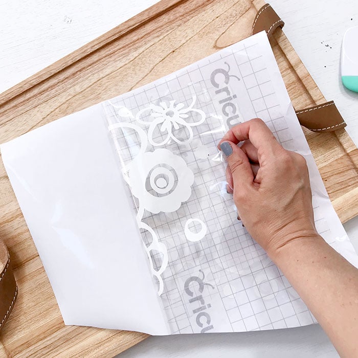 Use transfer tape to apply cut vinyl designs to create decor items
